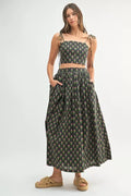 Woman wearing a LuxeHaven floral crop top and matching skirt set featuring feminine summer styling and a coordinated two-piece design