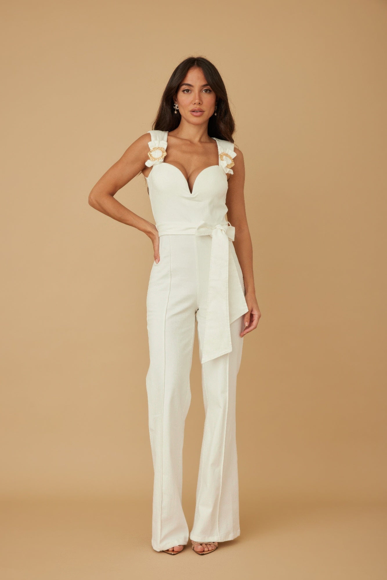 Woman wearing LuxeHaven intertwined ring detail jumpsuit with shoulder straps and a flattering silhouette.