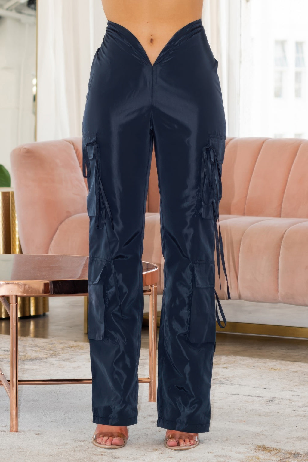 Women wearing LuxeHaven V-Cut Cargo Pants with wide-leg fit, V-shaped waistline, and side cargo pockets