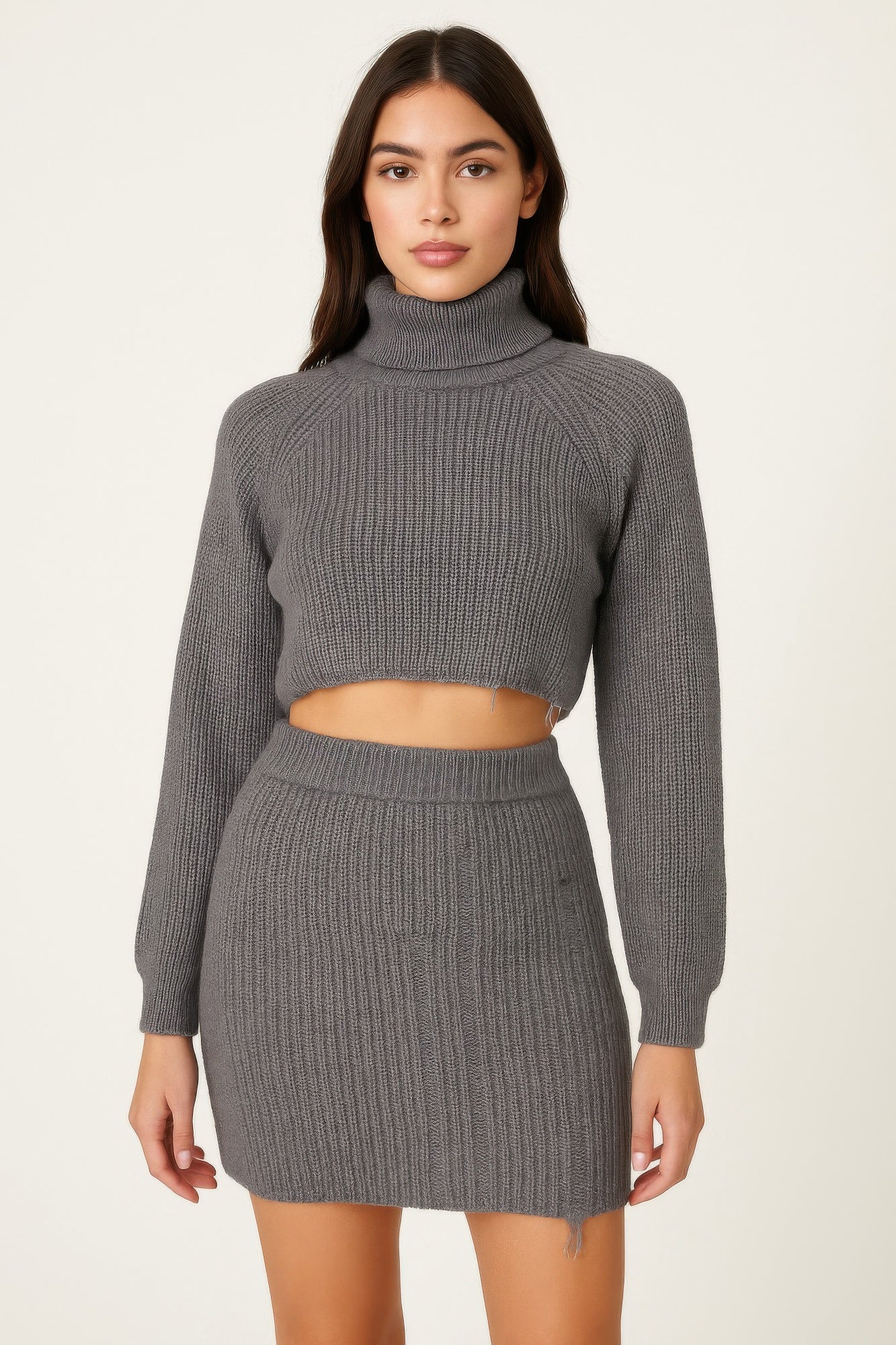 Woman wearing a LuxeHaven knit mock neck top and skirt set featuring a coordinated two-piece design and elegant knit styling