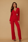 Woman wearing LuxeHaven™ oval crystal stone wrap jumpsuit with deep V-neck design