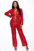 Woman wearing LuxeHaven™ sequin collared top and matching straight-leg pants set