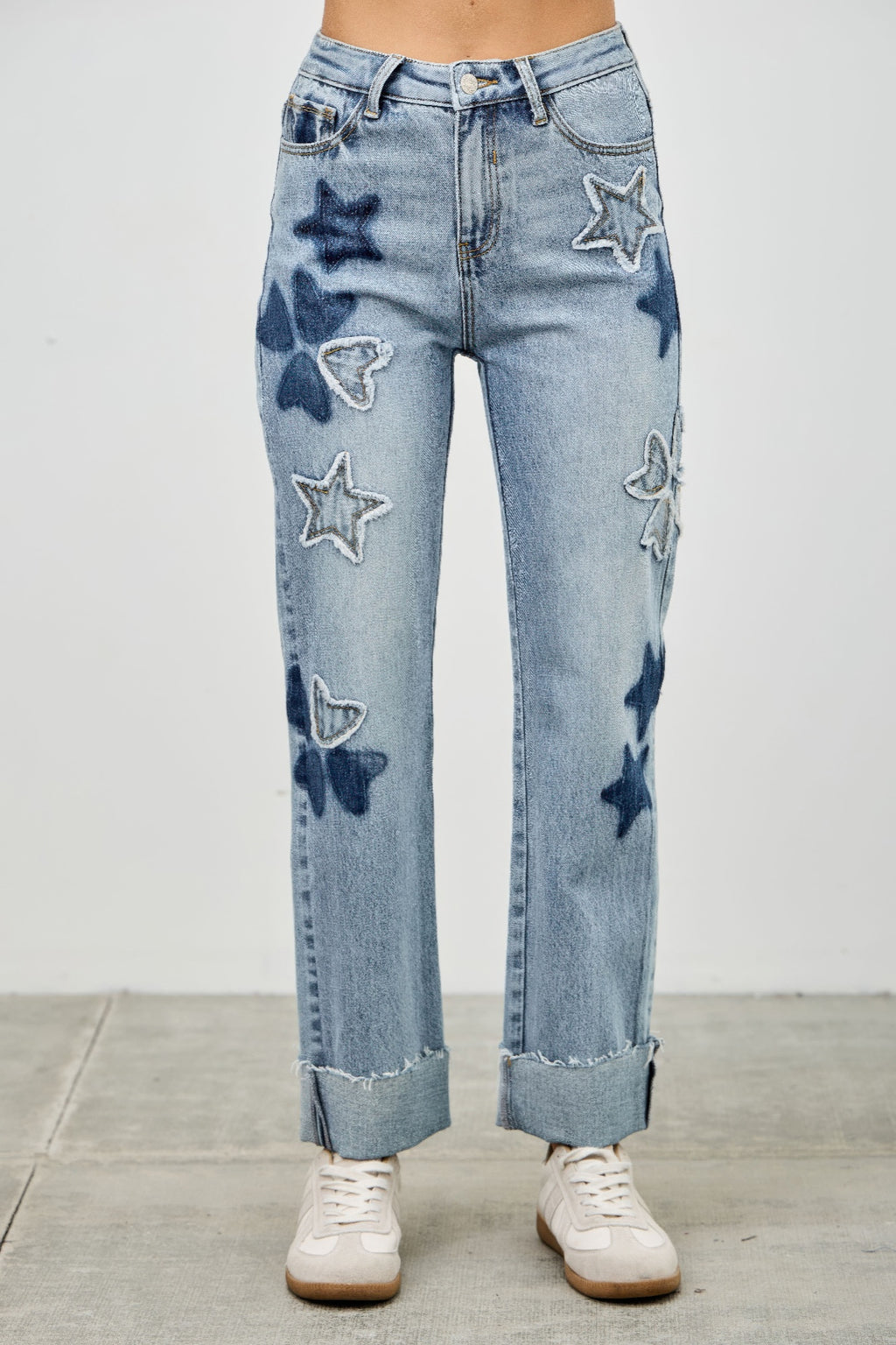 LuxeHaven™ high-rise dad jeans with star and heart patchwork detailing, stretch denim fabric, and relaxed straight-leg fit.