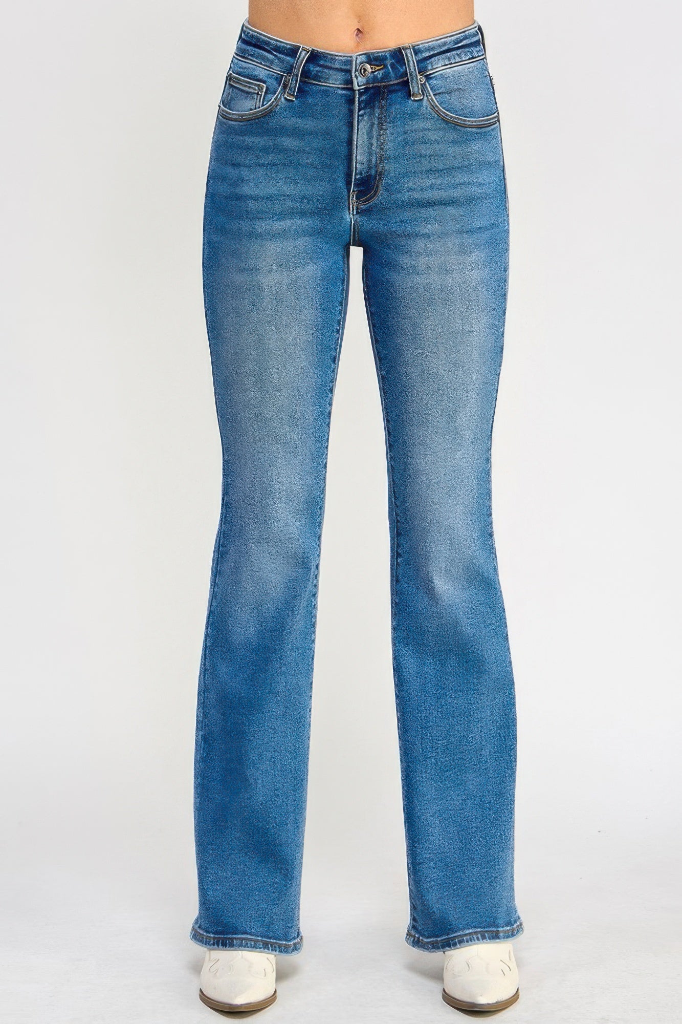 Woman wearing LuxeHaven tummy control mid-rise skinny bootcut jeans with a flattering fitted silhouette and bootcut leg.