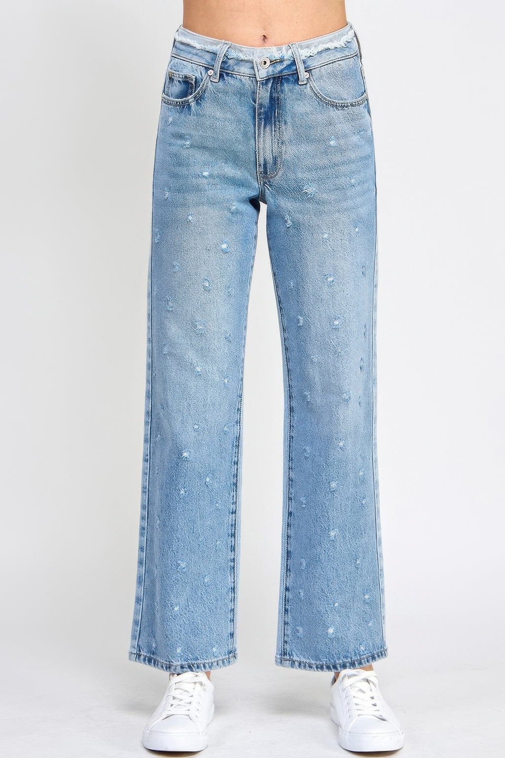High rise dad jeans with fringe waistband detail, relaxed fit silhouette, and stretch denim fabric