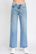 High rise dad jeans with fringe waistband detail, relaxed fit silhouette, and stretch denim fabric