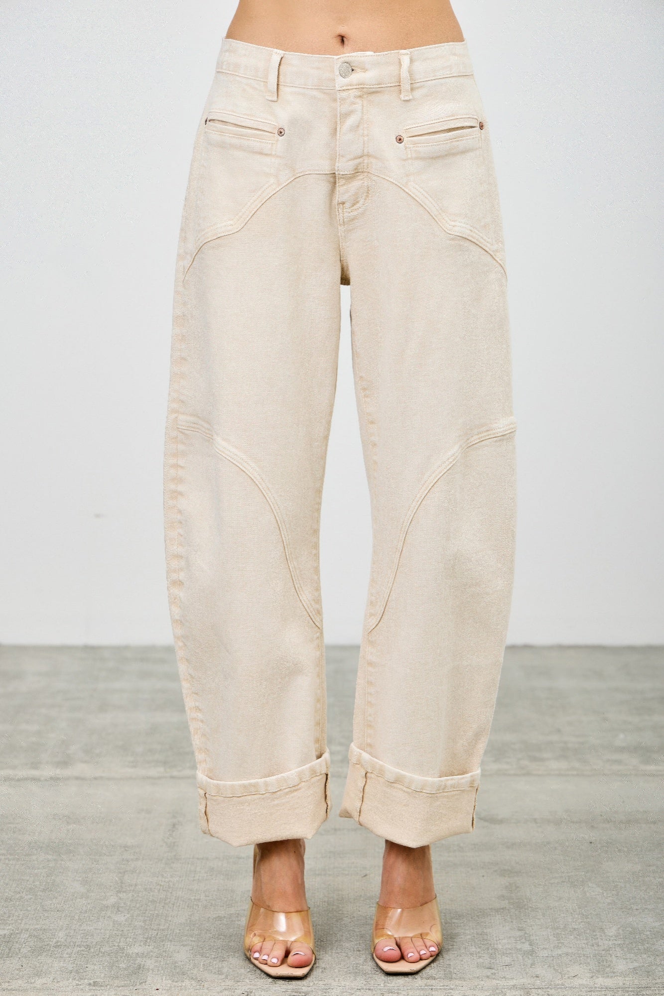 Woman wearing LuxeHaven high-rise colored western barrel pants with a modern barrel-leg silhouette.