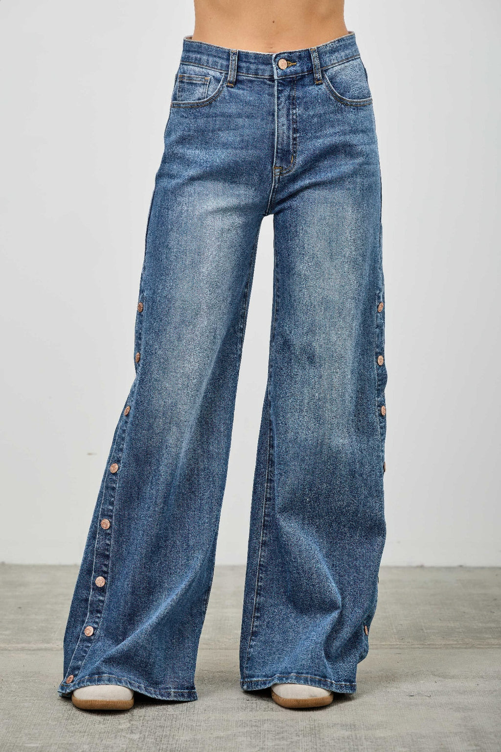 High rise wide leg denim jeans with side snap button slit detail and stretch cotton fabric
