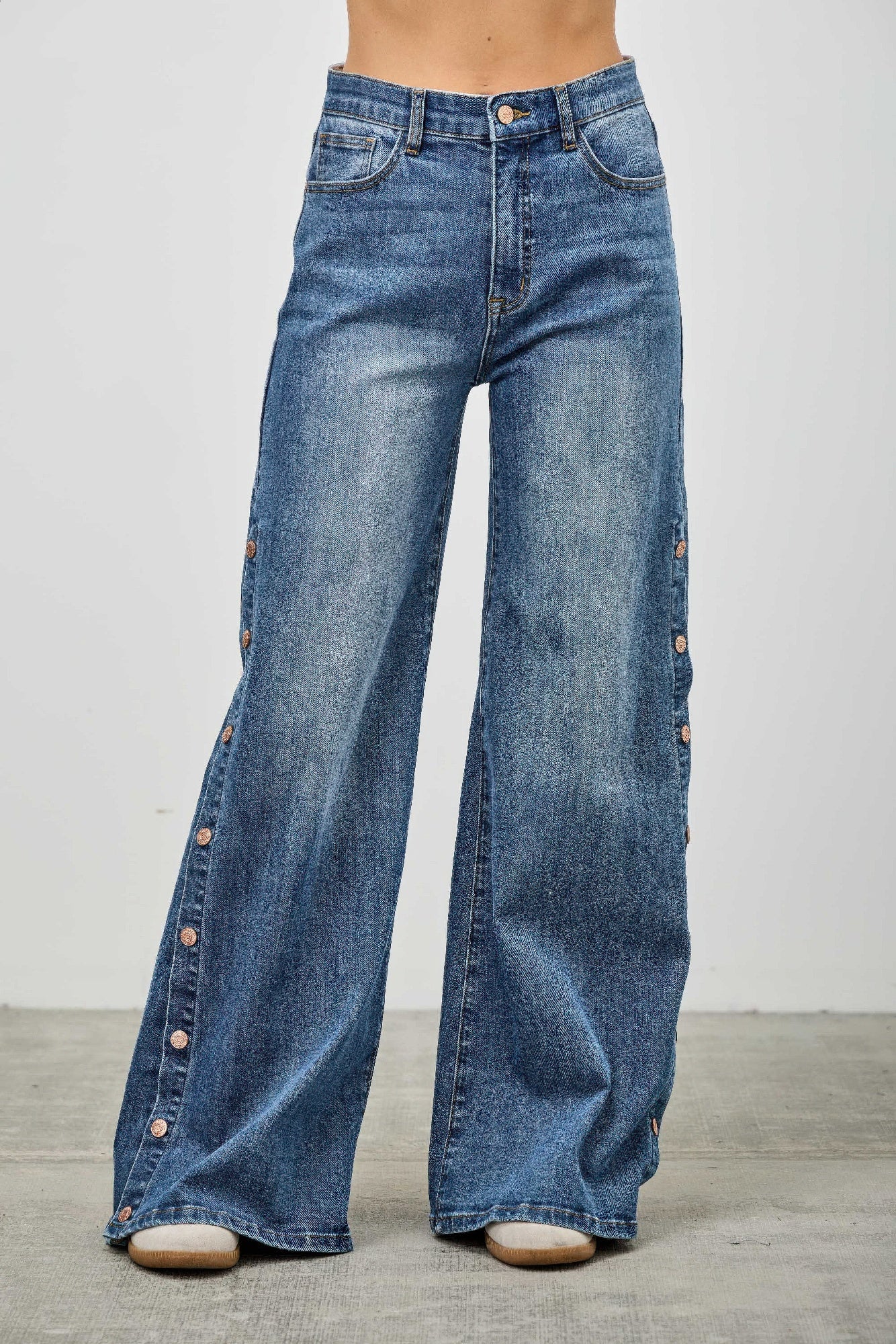 High rise wide leg denim jeans with side snap button slit detail and stretch cotton fabric