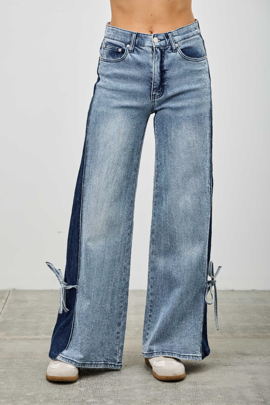 Woman wearing LuxeHaven™ high rise contrast wide leg denim jeans with ribbon tie detail