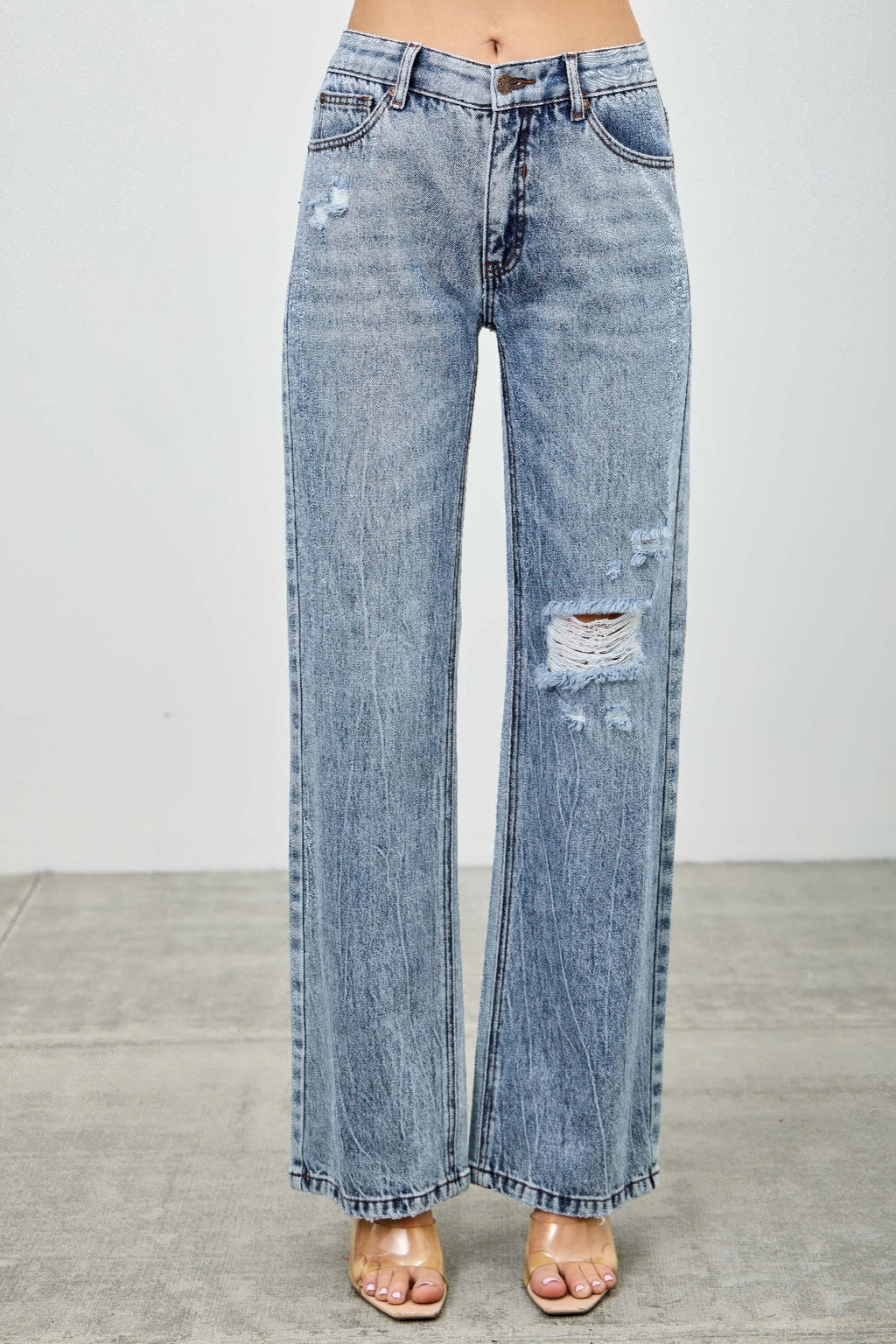 Women’s mid-rise relaxed straight-leg jeans with distressed detailing and vintage-inspired denim styling.