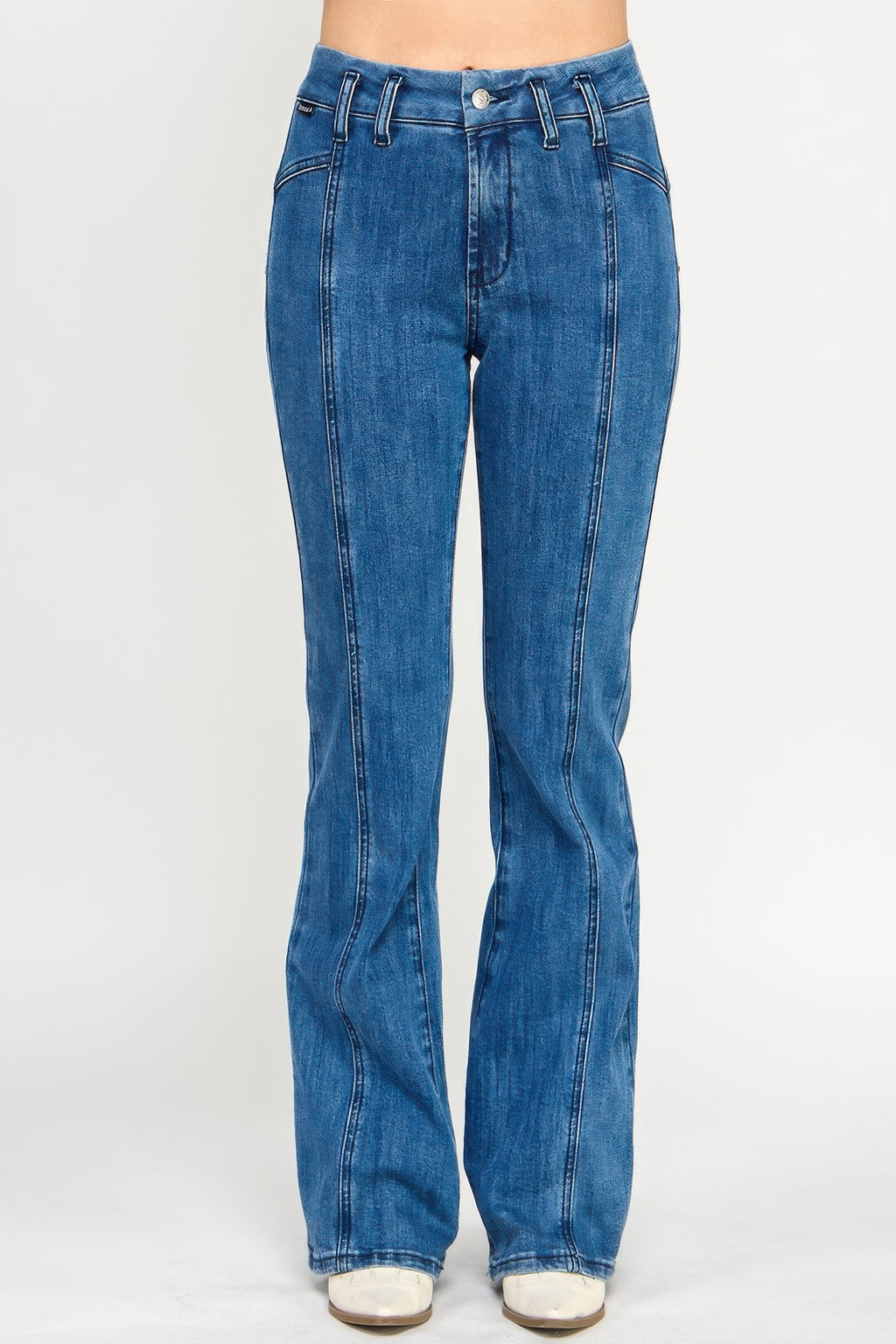 Women’s high-rise bell bottom jeans with seam detailing, stretch denim fabric, and retro-inspired silhouette.