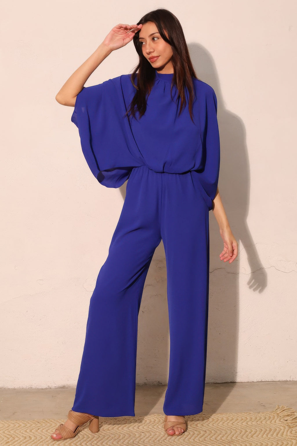 LuxeHaven™ Textured Solid Mock Neck Caftan Jumpsuit for women featuring a relaxed fit, textured fabric, mock neckline, and flowing wide leg silhouette