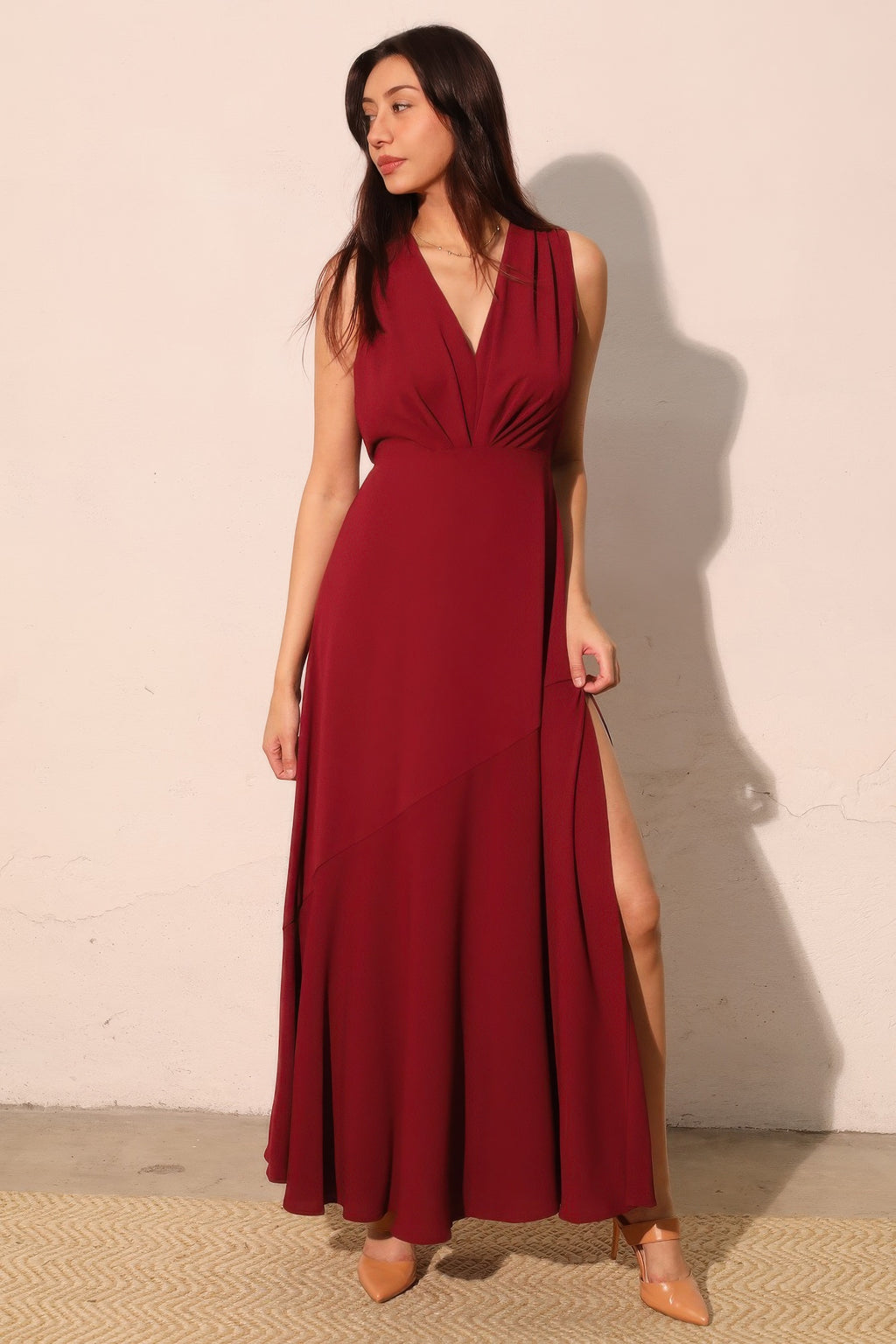 Woman wearing LuxeHaven textured solid V-neck maxi dress featuring a flowing silhouette and elegant design.