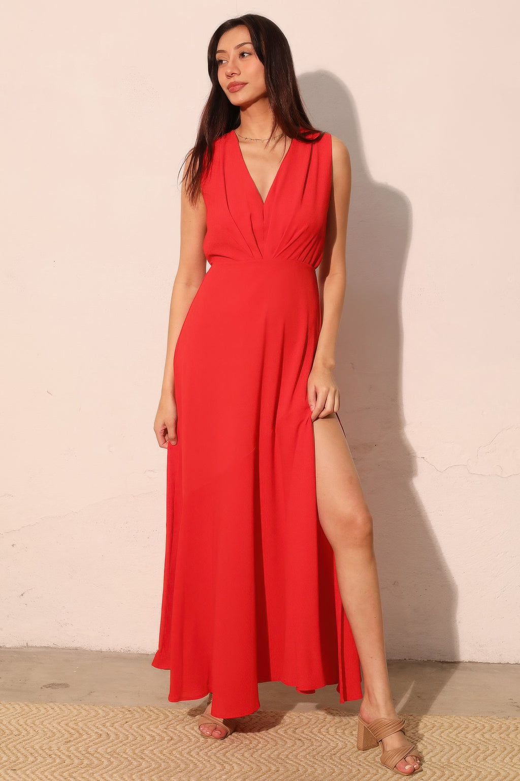 Woman wearing LuxeHaven textured solid V-neck maxi dress featuring a flowing silhouette and elegant design.