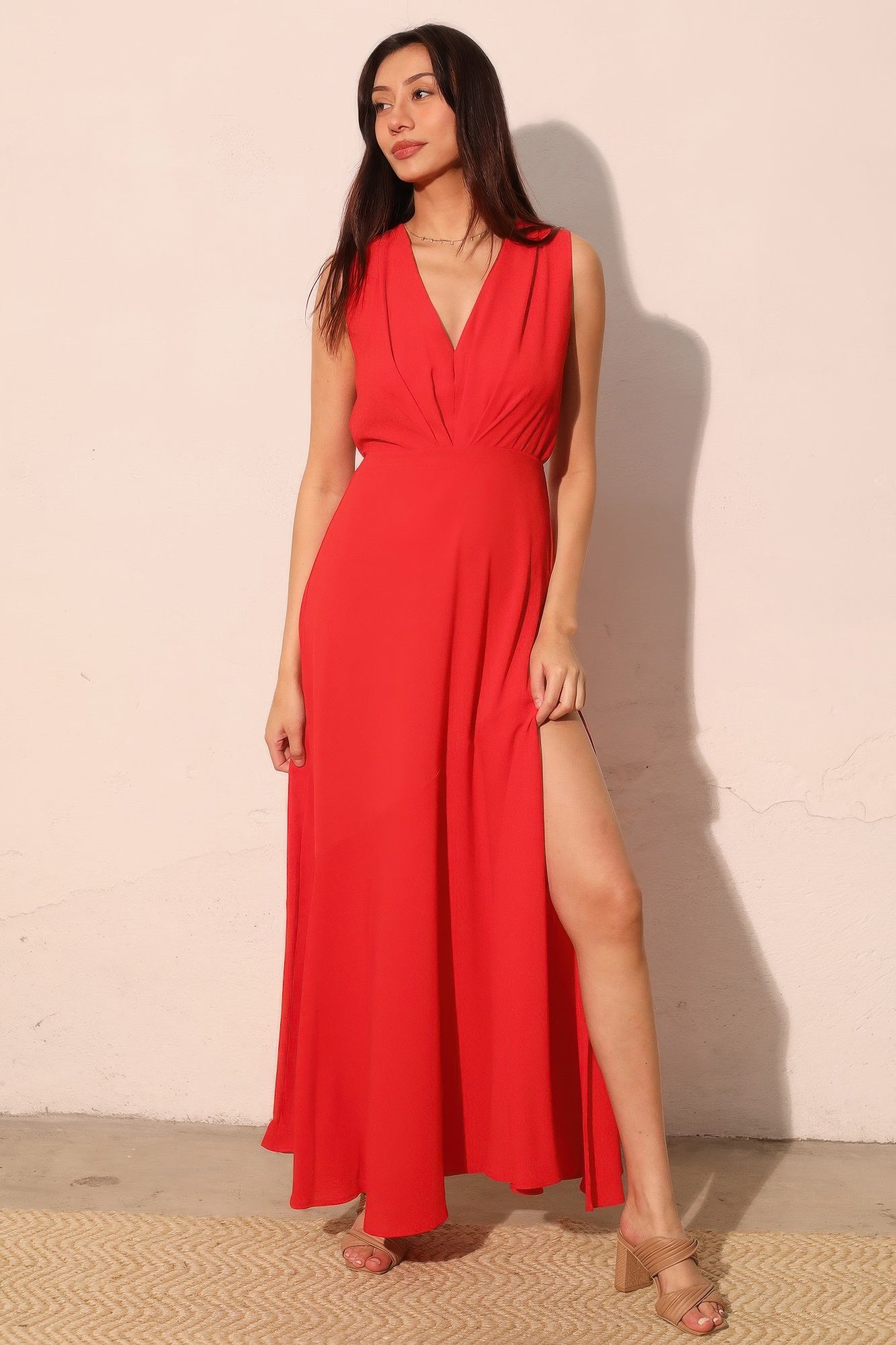 Woman wearing LuxeHaven textured solid V-neck maxi dress featuring a flowing silhouette and elegant design.
