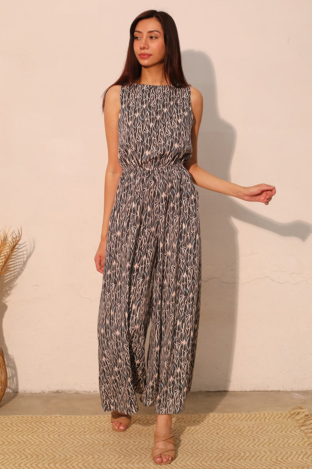 LuxeHaven™ women’s sleeveless bubble jumpsuit featuring lightweight flowy fabric, relaxed silhouette, and elegant drape for versatile statement styling.