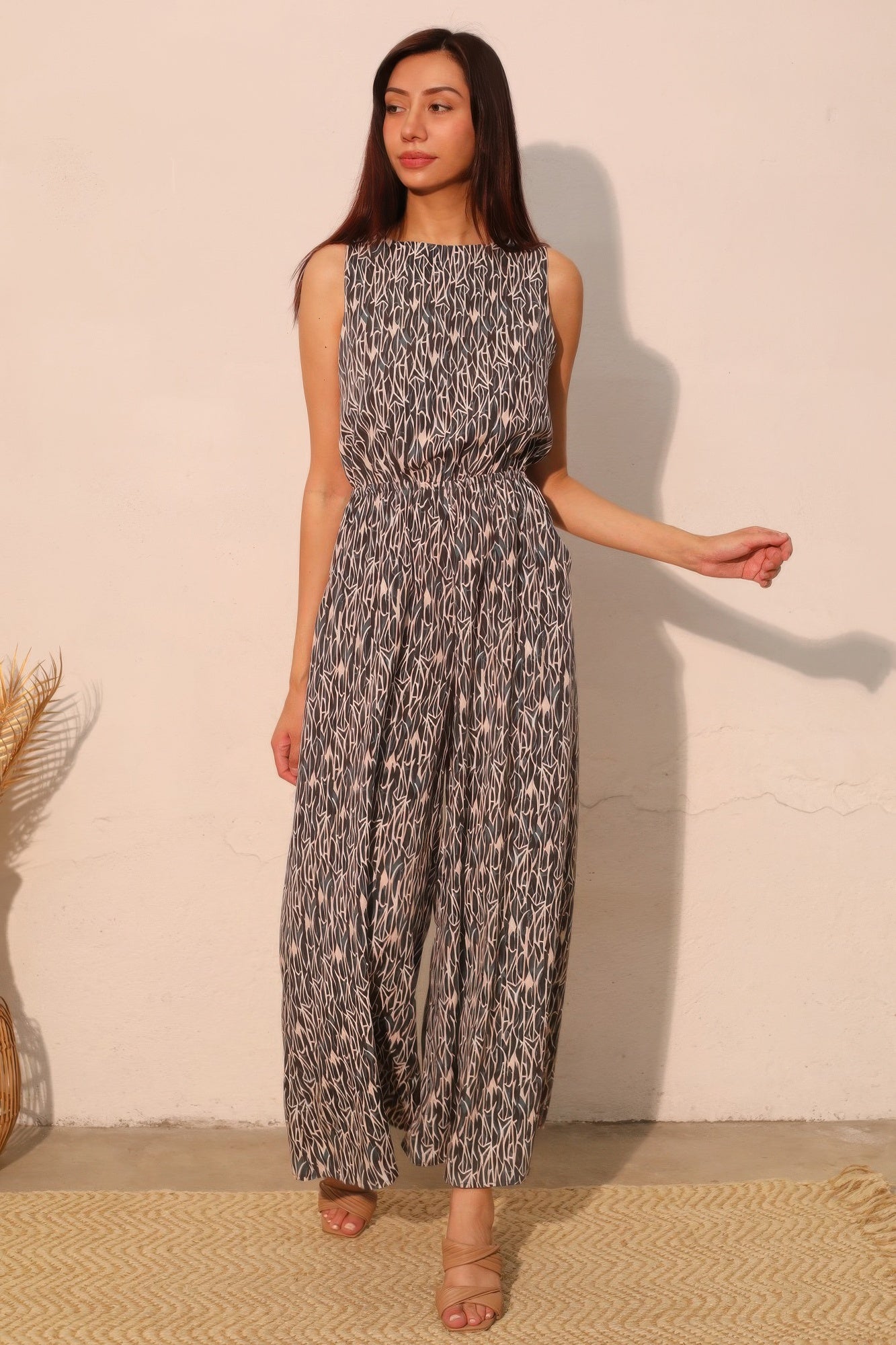 LuxeHaven™ women’s sleeveless bubble jumpsuit featuring lightweight flowy fabric, relaxed silhouette, and elegant drape for versatile statement styling.
