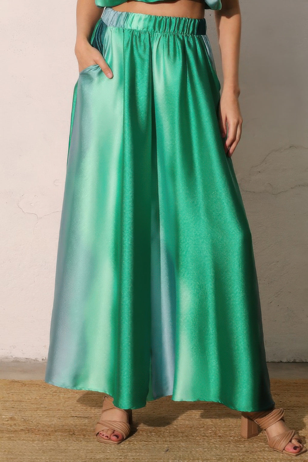 Woman wearing LuxeHaven ombre satin extra wide leg pants featuring a flowing silhouette, smooth satin fabric, and elegant gradient color design