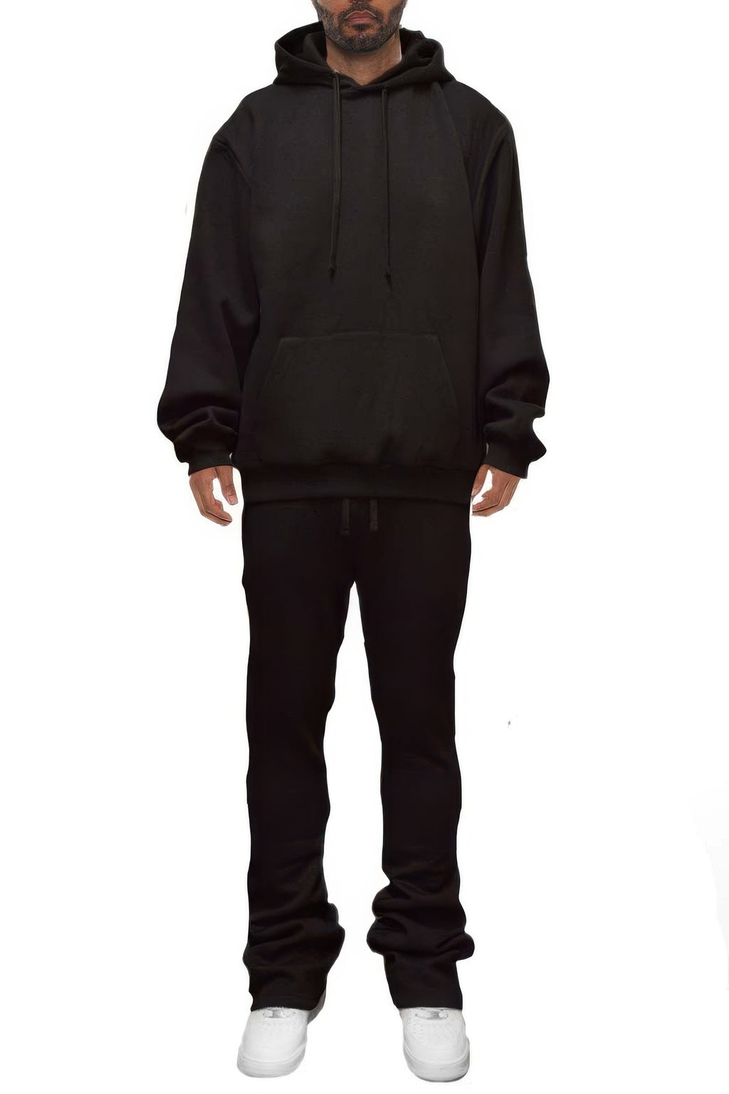 Man wearing LuxeHaven solid stacked flared track set with matching track jacket and flared track pants.