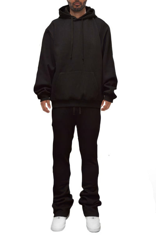 Man wearing LuxeHaven solid stacked flared track set with matching track jacket and flared track pants.