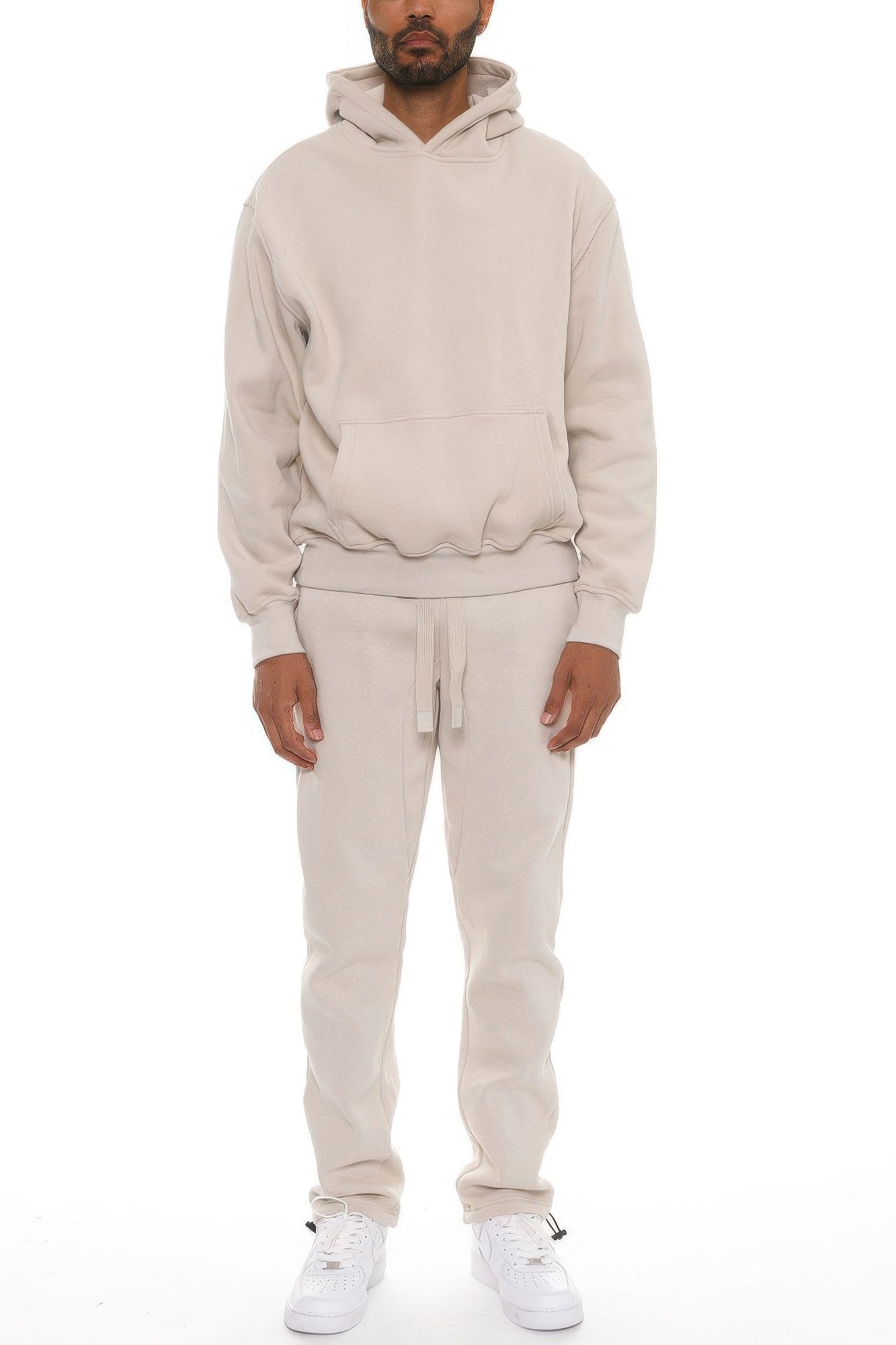 Man wearing LuxeHaven premium cotton blend hoodie set with matching pants, comfortable two-piece casual tracksuit.