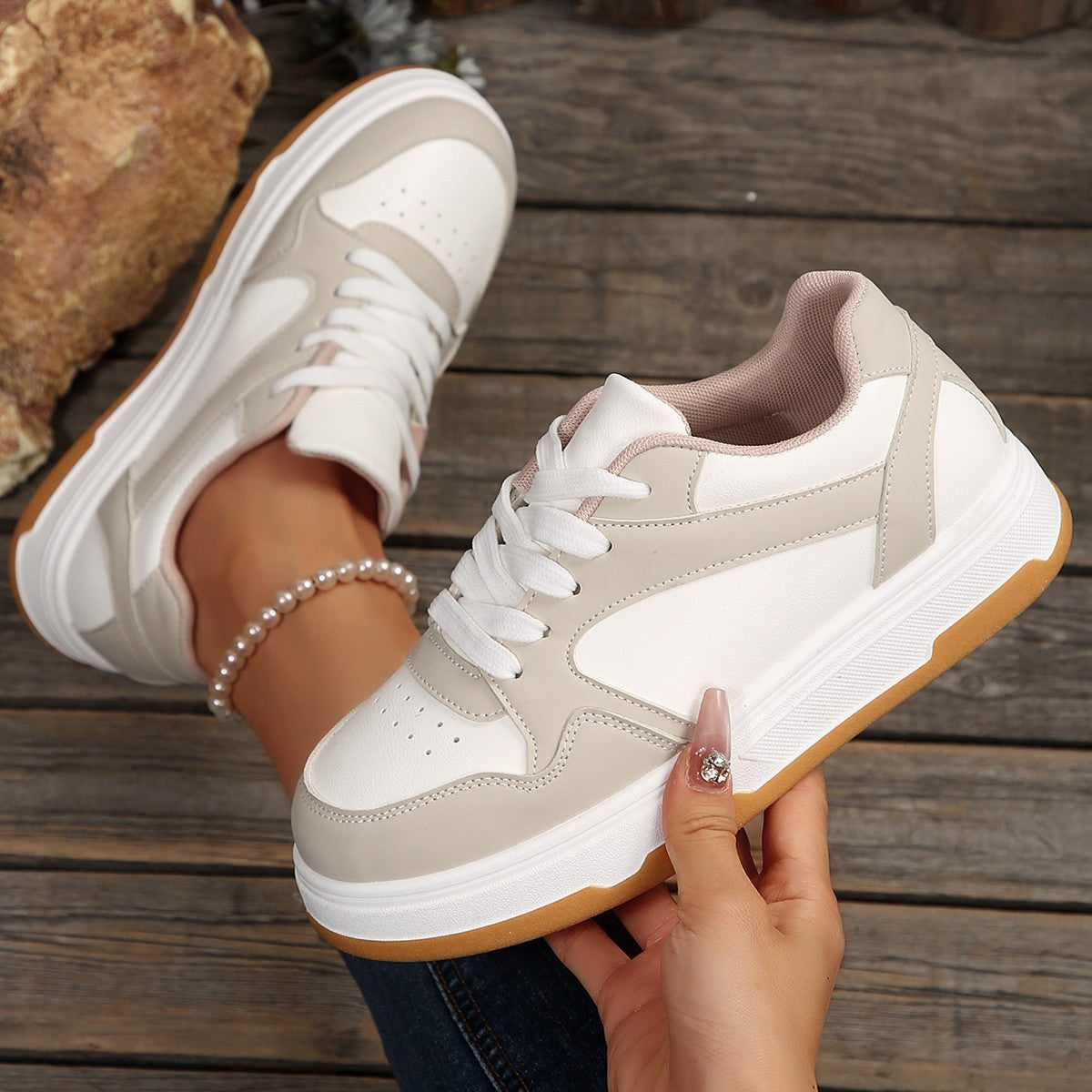 Woman wearing LuxeHaven trendy Korean-style thick-soled casual sneakers.